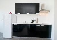 Kuchyň nebo kuchyňský kout v ubytování Rooms & Apartments Marinero