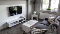 Televízia a/alebo spoločenská miestnosť v ubytovaní Apartamenty Cicha by Royal Aparts