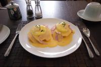 een witte plaat met voedsel op een tafel bij The Rooms Lytham in Lytham St Annes