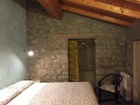 A bed or beds in a room at Agriturismo Spizzirò