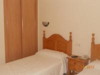Posteľ alebo postele v izbe v ubytovaní Hostal Restaurante Hermanos Zamora