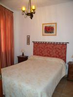 Postel nebo postele na pokoji v ubytování Apartamentos Rurales Parque