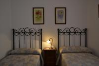 Postel nebo postele na pokoji v ubytování Apartamentos Rurales Parque