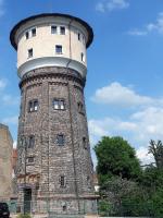 a tall building with a round tower on top at Wasserturm Angermünde in Angermünde