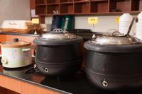 three pots and pans sitting on a counter in a kitchen at F Hotel - Chiayi in Fanlu