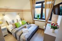 Łóżko lub łóżka w pokoju w obiekcie Apartamenty Królewska Kwatera
