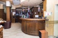a bar in a restaurant with a wooden counter at Hotel St Valentine all inclusive in Sunny Beach