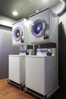 two machines on a shelf in a room at Tomorrow Hotel in Taipei