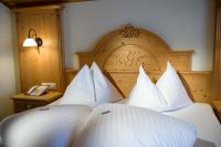 Łóżko lub łóżka w pokoju w obiekcie Hotel Gamsleiten