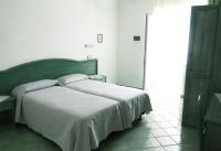 Postel nebo postele na pokoji v ubytování Albergo Villa Mario