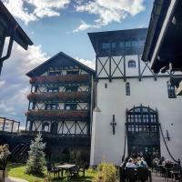 a building with people sitting at tables in front of it at Podu&#39; cu Lanturi in Bacău