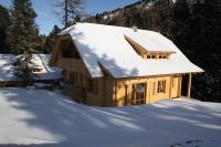 a house with a snow covered roof in the snow at Alpin-Hütten auf der Turracherhöhe Haus Murmeltier by S4Y in Turracher Hohe