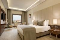A bed or beds in a room at Ramada by Wyndham Yalova
