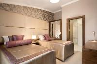 A bed or beds in a room at Ramada by Wyndham Yalova