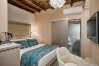 A bed or beds in a room at Reginella Suites