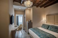 A bed or beds in a room at Reginella Suites