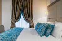 A bed or beds in a room at Reginella Suites