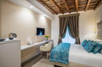 A bed or beds in a room at Reginella Suites
