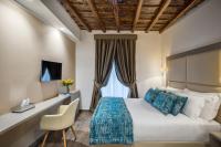 A bed or beds in a room at Reginella Suites