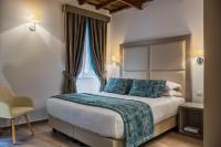 A bed or beds in a room at Reginella Suites