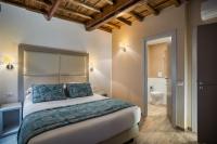 A bed or beds in a room at Reginella Suites