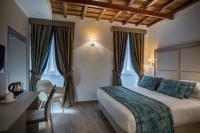 A bed or beds in a room at Reginella Suites