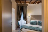 A bed or beds in a room at Reginella Suites