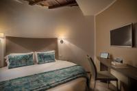 A bed or beds in a room at Reginella Suites