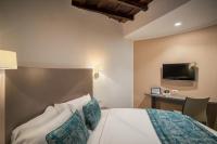 A bed or beds in a room at Reginella Suites