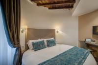 A bed or beds in a room at Reginella Suites