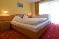 Łóżko lub łóżka w pokoju w obiekcie Gasthaus-Landhotel Traunstein
