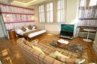 a living room with a couch and a tv at ABode Manchester in Manchester