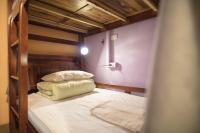 a bedroom with two bunk beds in a room at On My Way Jiufen Youth Hostel in Jiufen