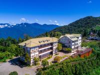 an aerial view of a hotel with mountains in the background at Jun Yue Hanging Garden Resort in Ren&#39;ai