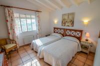 A bed or beds in a room at Marcelo - charming, Finca style holiday villa in Moraira