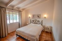 A bed or beds in a room at Marcelo - charming, Finca style holiday villa in Moraira