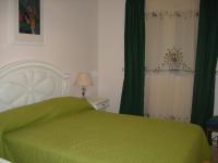 A bed or beds in a room at Green I