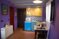 Kuchyň nebo kuchyňský kout v ubytování Apartamentos La Iguana