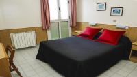 Łóżko lub łóżka w pokoju w obiekcie Hotel Piñupe