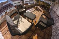 an overhead view of a patio with chairs and a table at Hostal Caminito del Rey in Alora