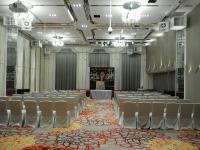 a large room with rows of chairs and a stage at Platinum Hotel in Xindian