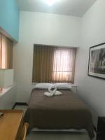 Ein Bett oder Betten in einem Zimmer der Unterkunft West Side YMCA