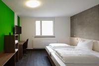 Postel nebo postele na pokoji v ubytování a2 HOTELS Plochingen