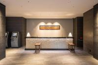 a lobby with a counter and two stools at Tokyu Stay Kyoto Sanjo-Karasuma in Kyoto