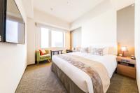 a bedroom with a large bed and a window at Tokyu Stay Kyoto Sanjo-Karasuma in Kyoto