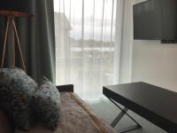 Televízia a/alebo spoločenská miestnosť v ubytovaní Armada Holiday House