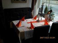 a table with red paper napkins on top of it at Pension Balkan in Eisenhüttenstadt