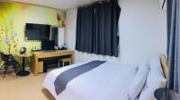 Hotel Joy near Camp Humphresにあるベッド