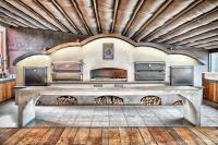 a room with a large stone table with fireplaces at IOTA Hotel Tbilisi in Tbilisi City