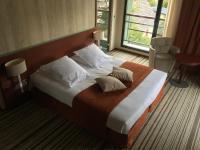 Ein Bett oder Betten in einem Zimmer der Unterkunft Hotel du Casino